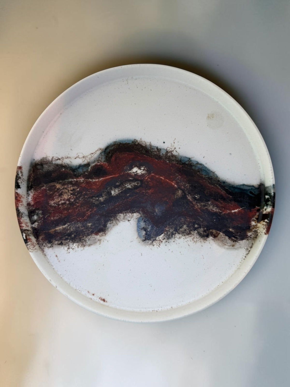 Echoes of Fire nesting plates, saggar-fired porcelain, three nested together