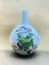 Nishihara Akira polychrome figure bottle vase, front